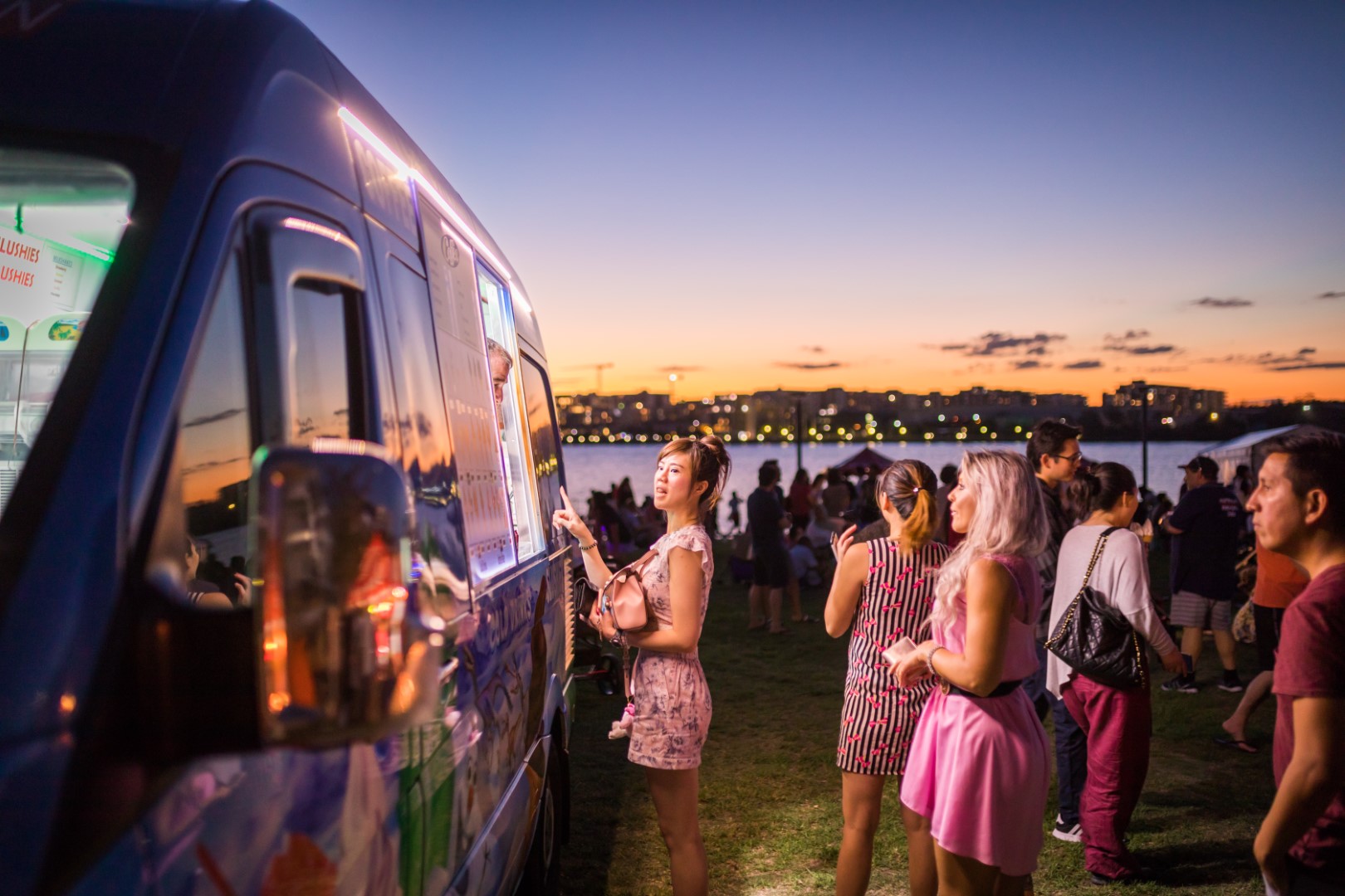 Woman ordering food from a food truck at Rhodes Foreshore Park