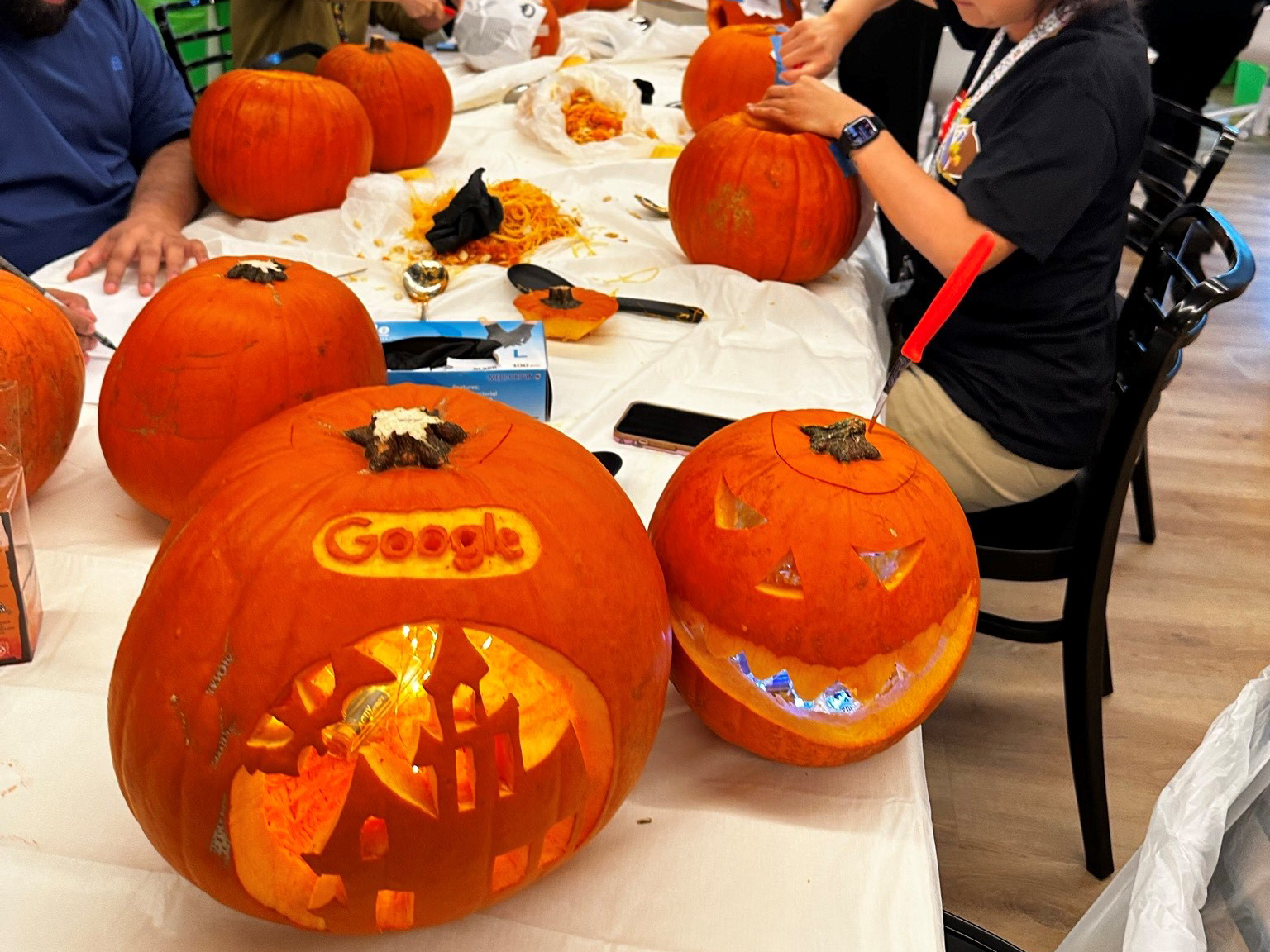 People carving pumpkins