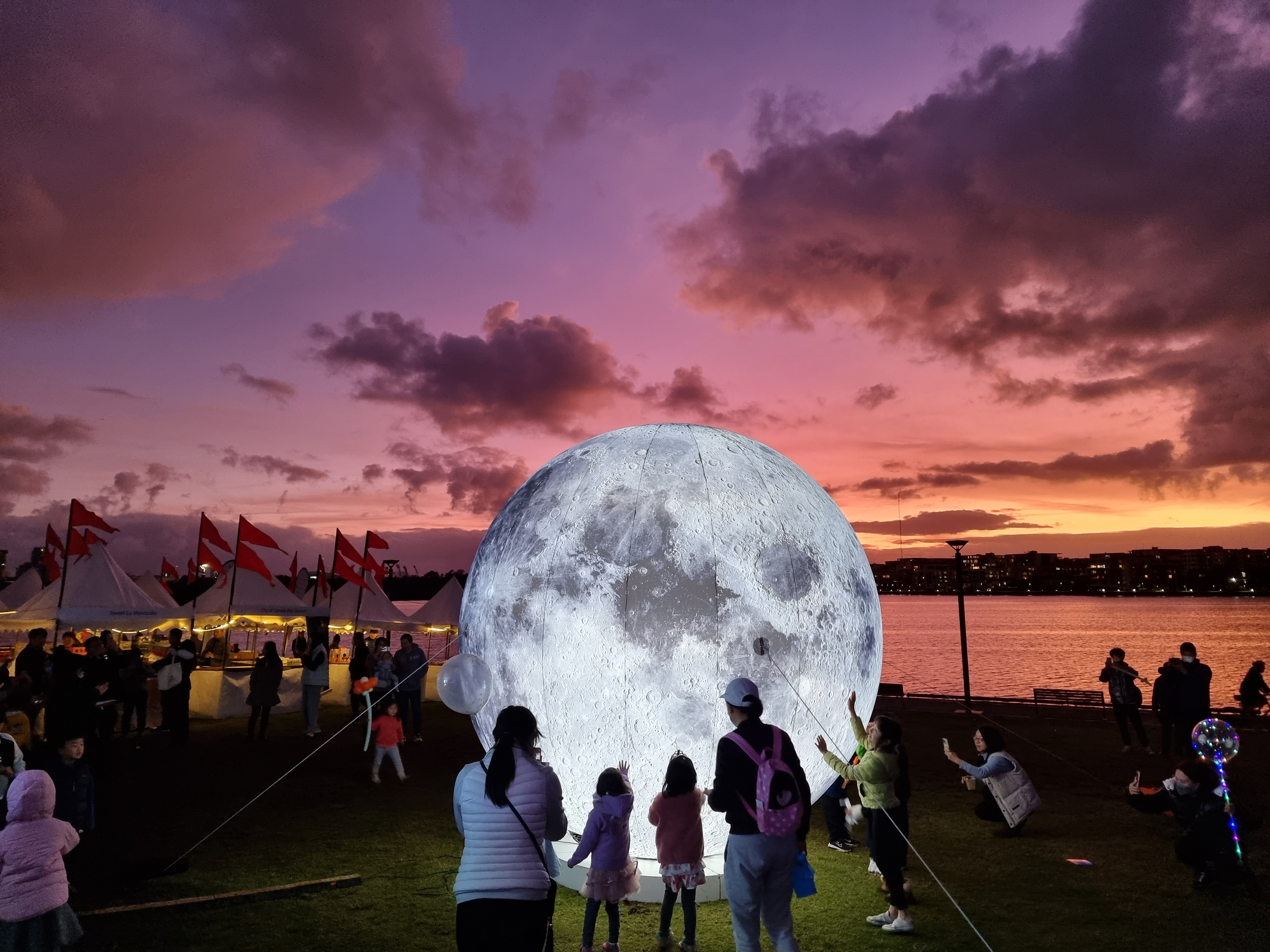 People looking at the moon light display at Rhodes