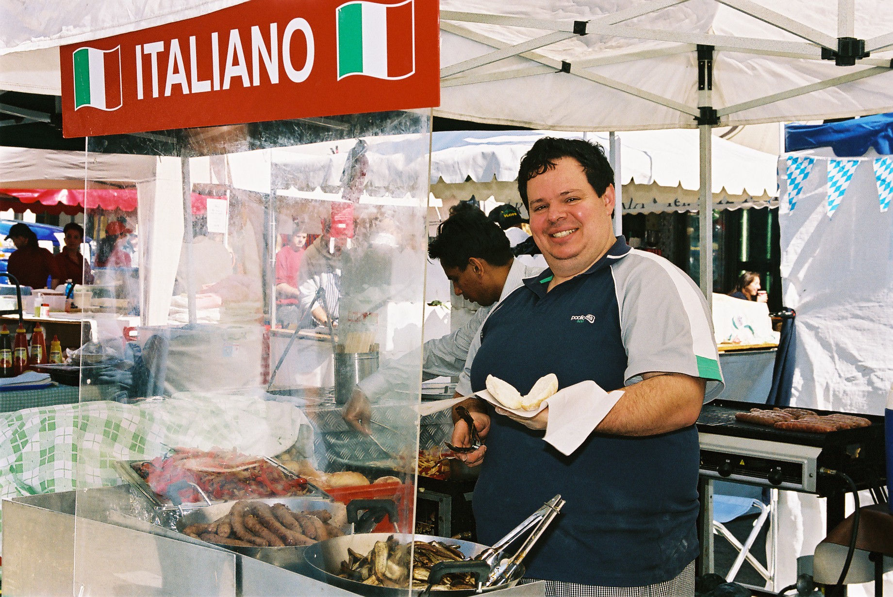 Man smiling at italiano stall