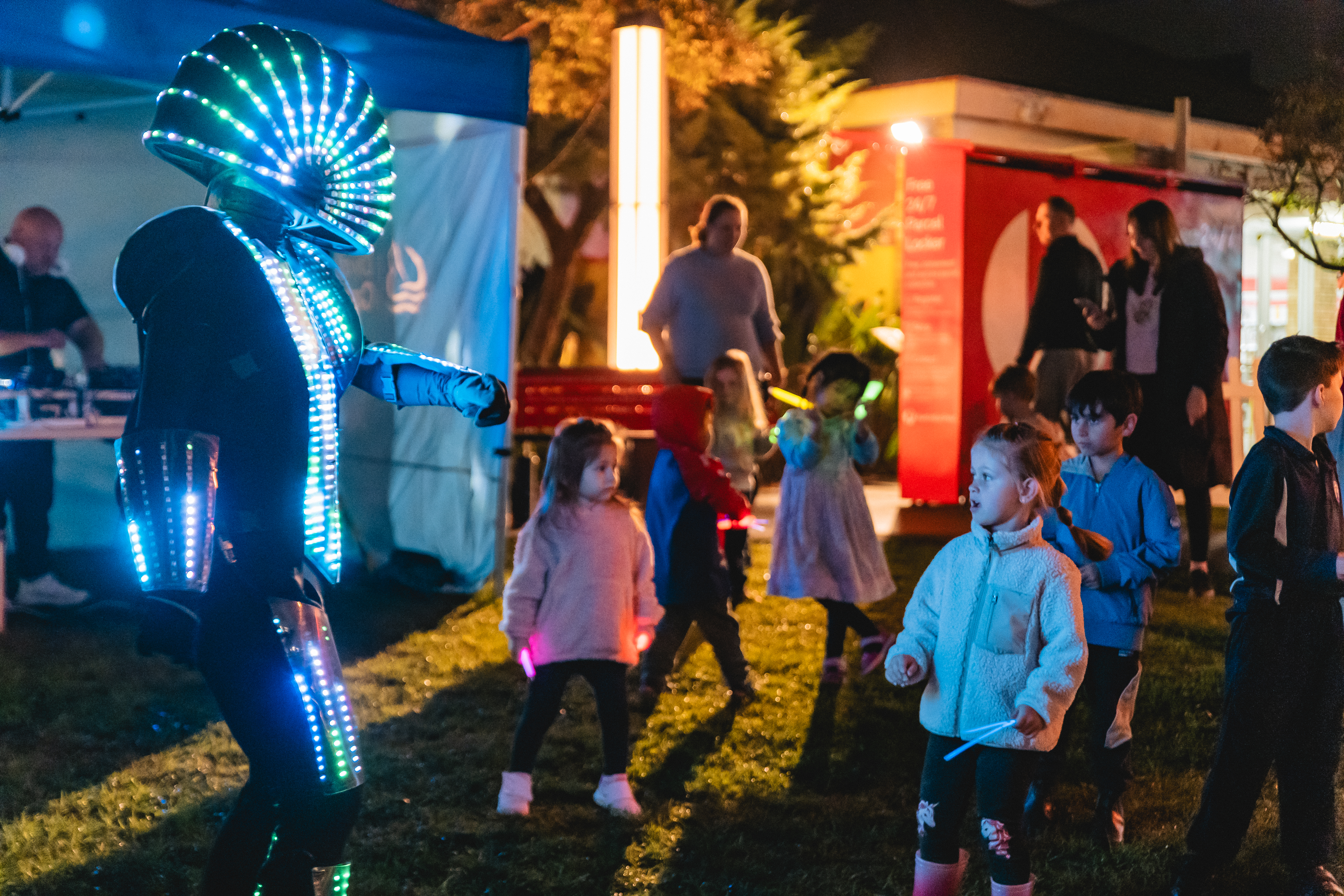 Kids dancing with the LED robot rover