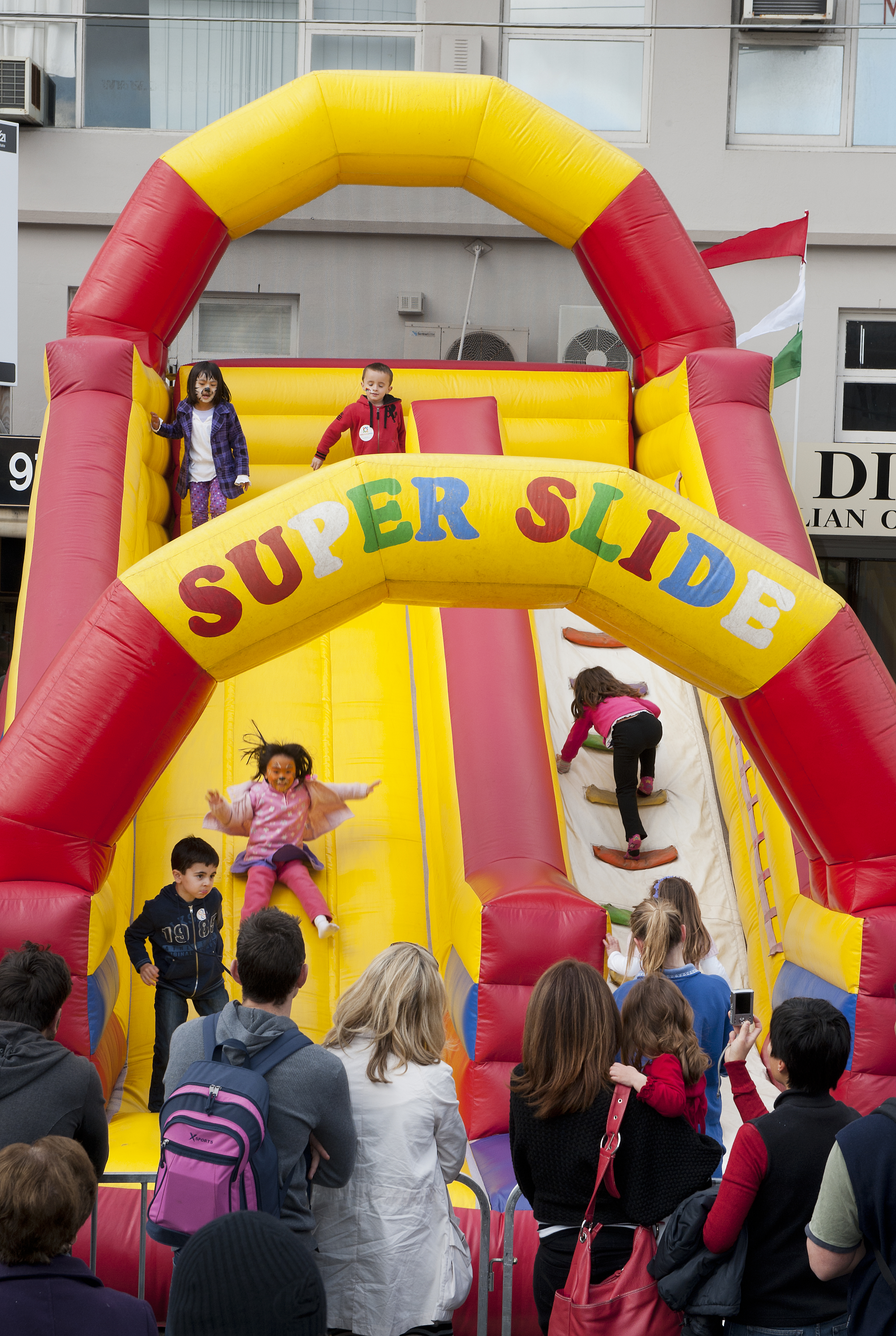 kids going down an inflatable slide