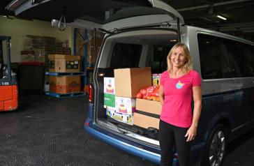 Image of local resident Justine Perkins with car-boot full of groceries