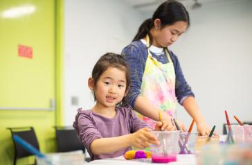 Child doing craft at the library