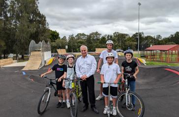 Group of children and Mayor at BMX Jump track